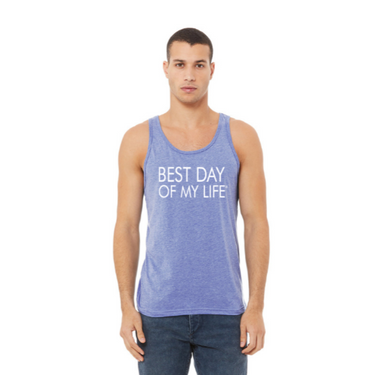 medium-skinner person with short hair wearing a blue tank top with best day of my life written in white